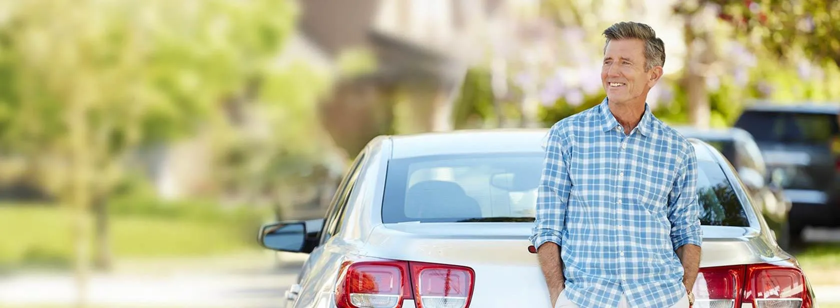 a man at peace knowing he is protected by the AARP Auto Insurance Program from The Hartford