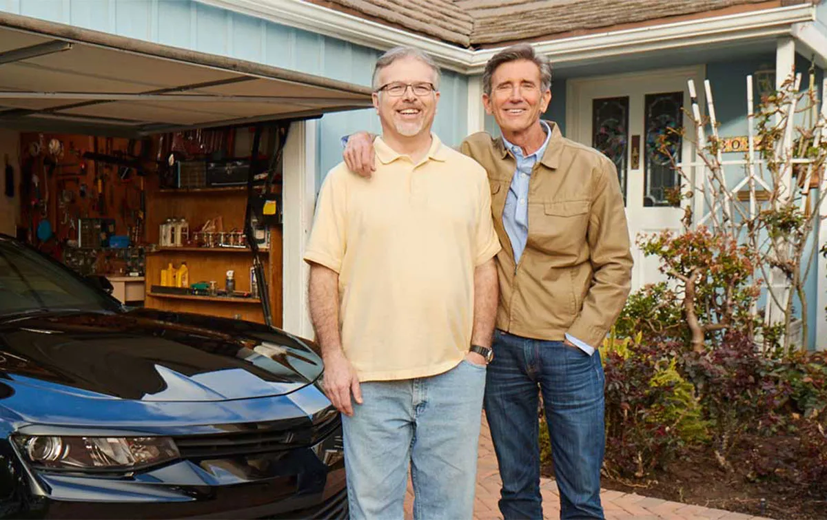 Homeowners in front of their home protected by aarp homeowners insurance